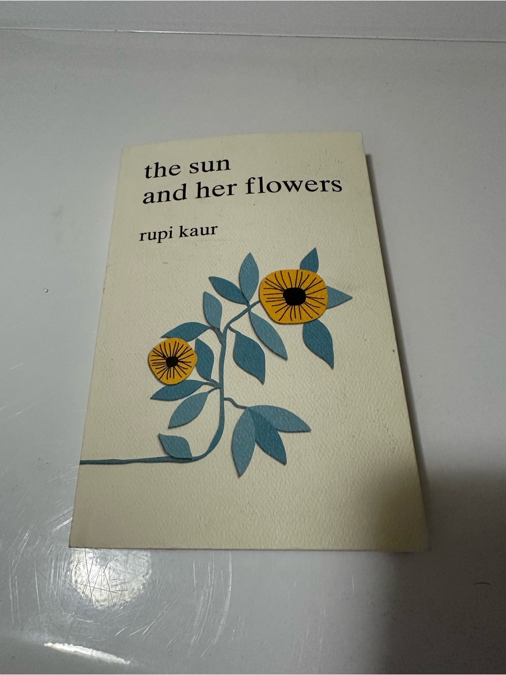 The sun and her flowers book by Rupi Kaur